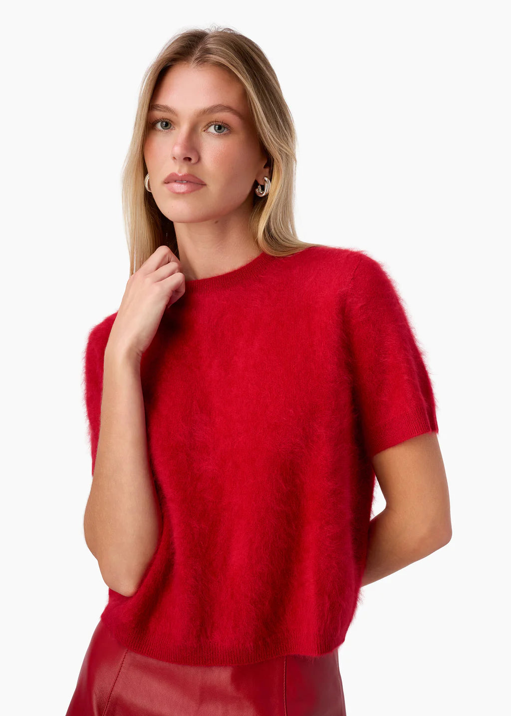 Woman wearing a red sweater on a white background