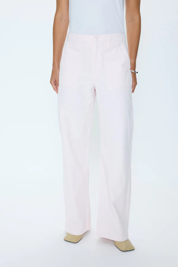 White pants with beige accents worn by a person on a white background