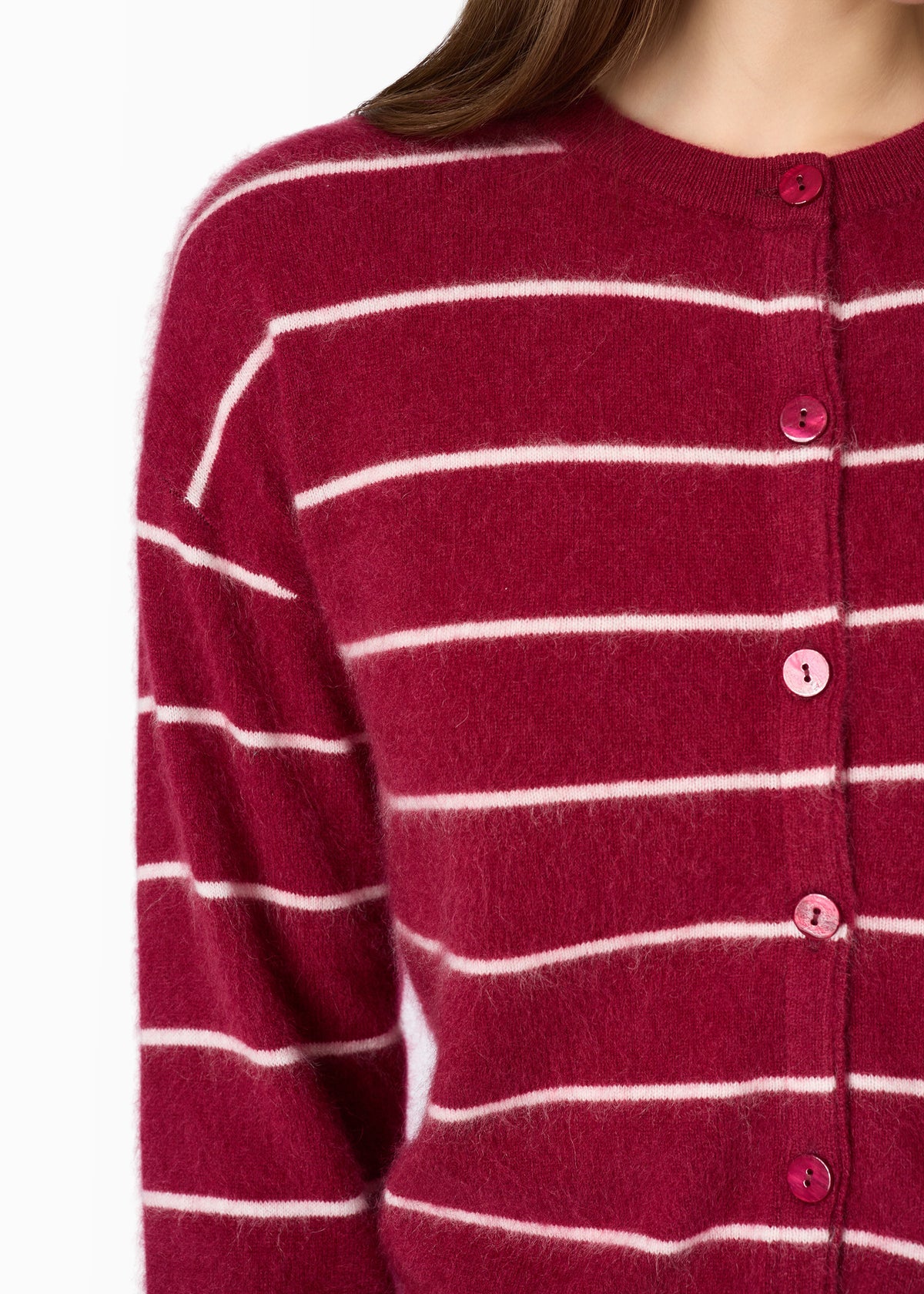 close up of a stripe cardigan on a model with tonal buttons 
