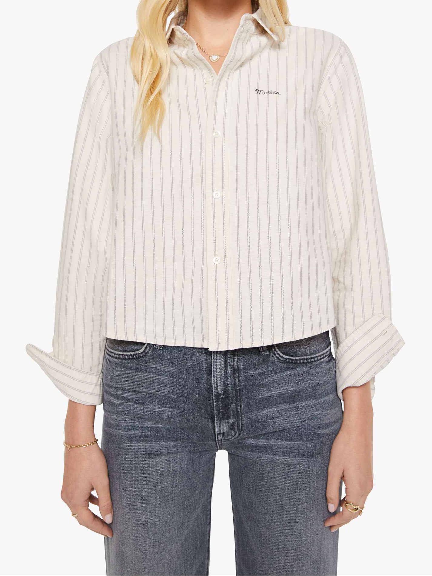 Woman wearing a striped shirt and sunglasses on a white background