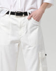 White pants with a black belt on a plain background