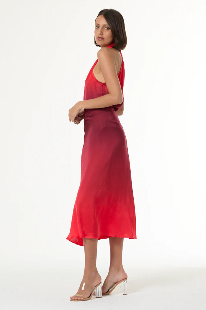 Woman wearing a red dress on a white background
