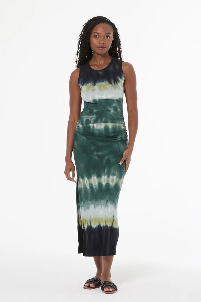 Woman wearing a tie-dye dress on a white background