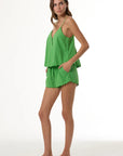 Rexy Swing Top and Rexy Short full body side, hand in pocket 