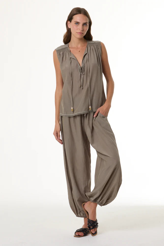 Arna Harem Jogger full body front view on model with her leg propped up against her ankle