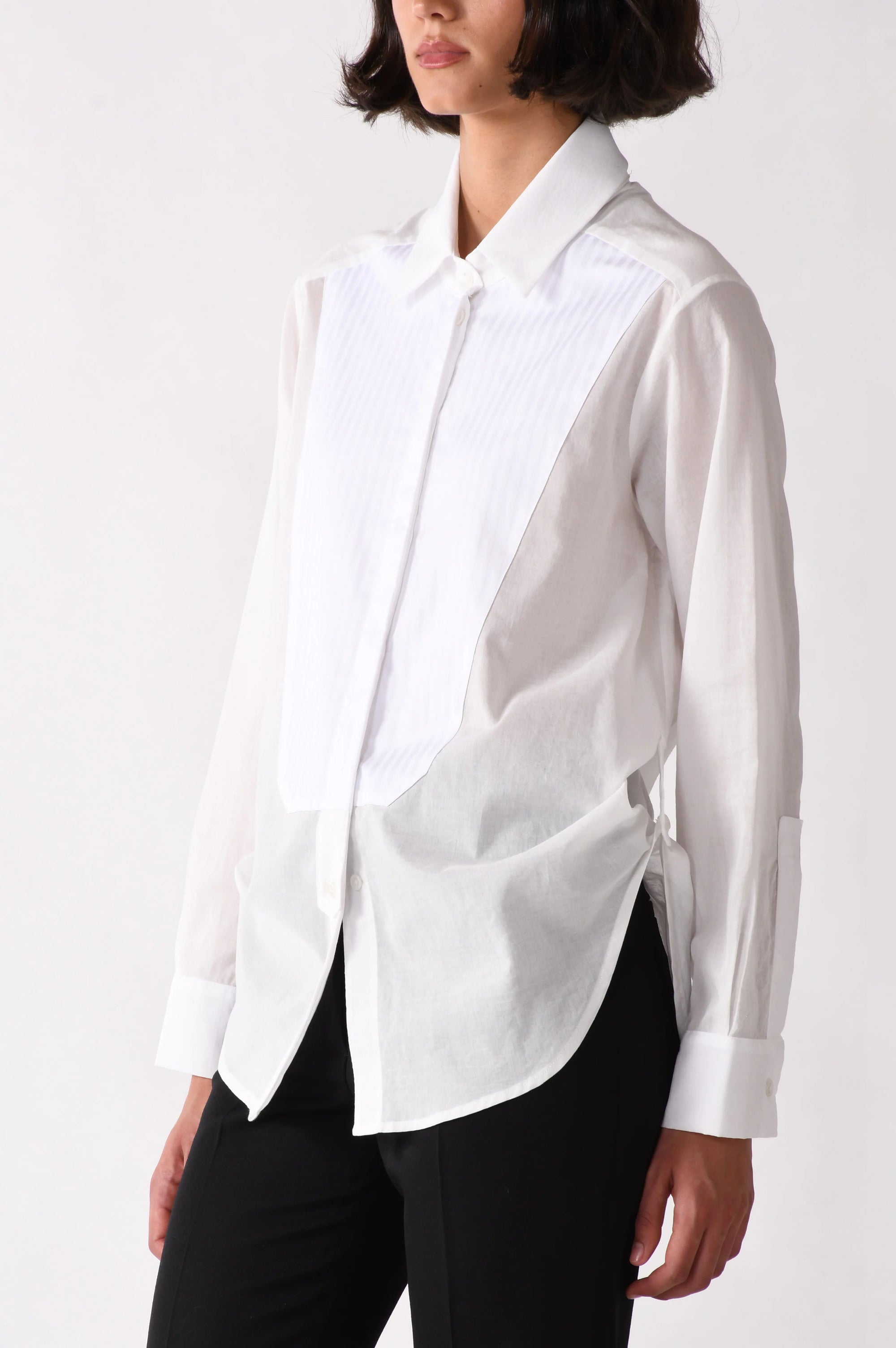 White blouse worn by a person on a white background
