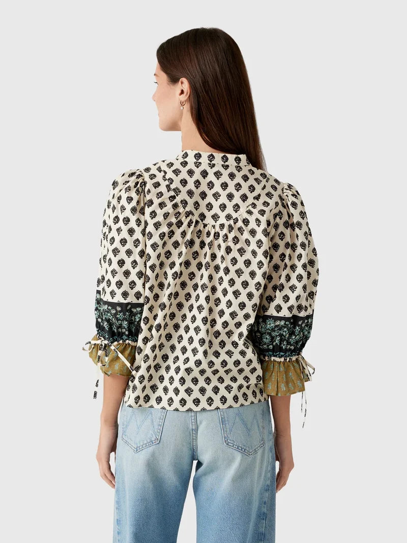 model wearing print rory top with jeans on a white background, back