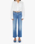 Woman wearing a white blouse and blue jeans on a white background