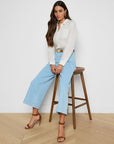 Houston Cropped Wide-Leg Jean model sitting on stool