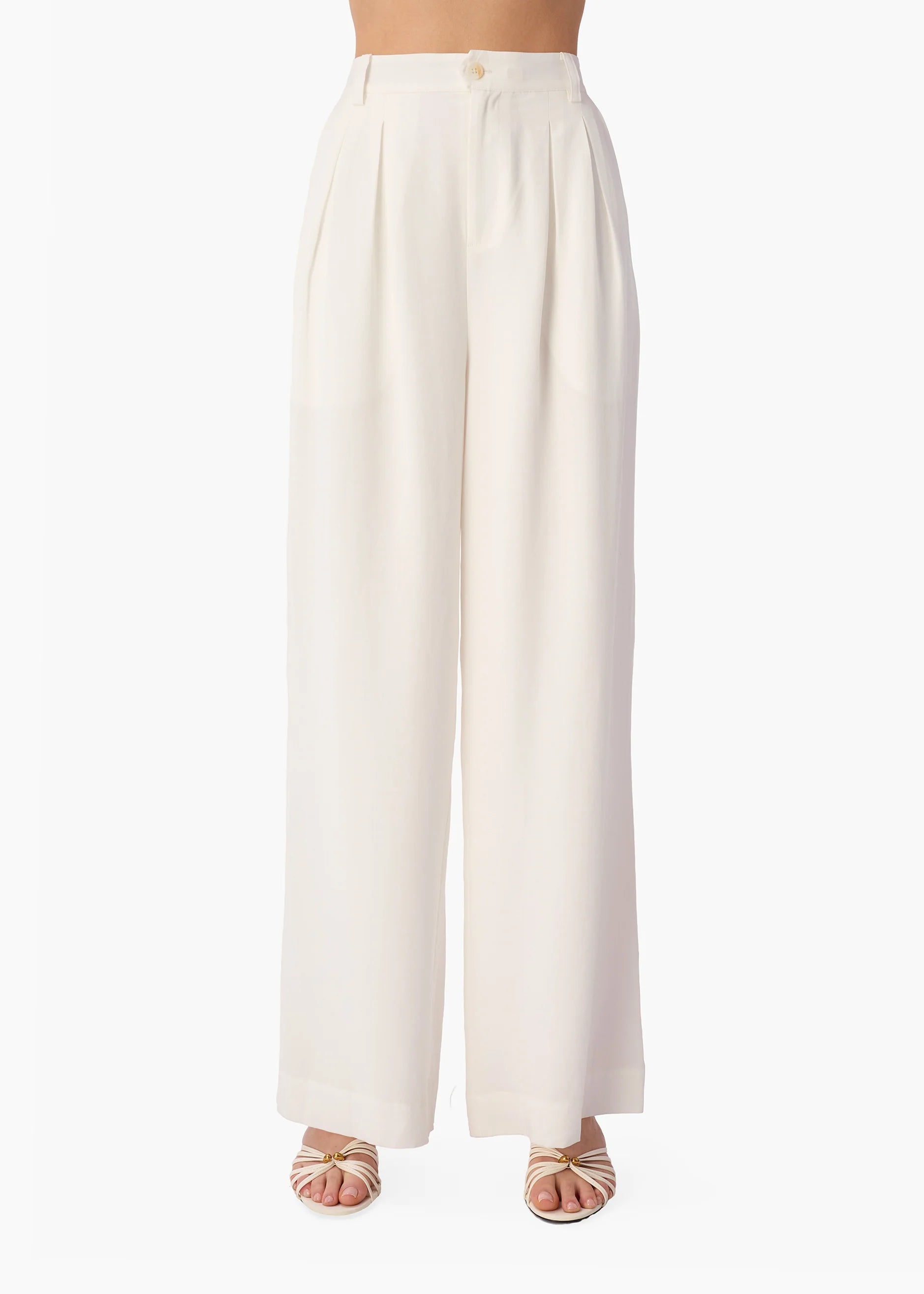 White wide-leg pants worn by a person on a white background