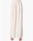 White wide-leg pants worn by a person on a white background