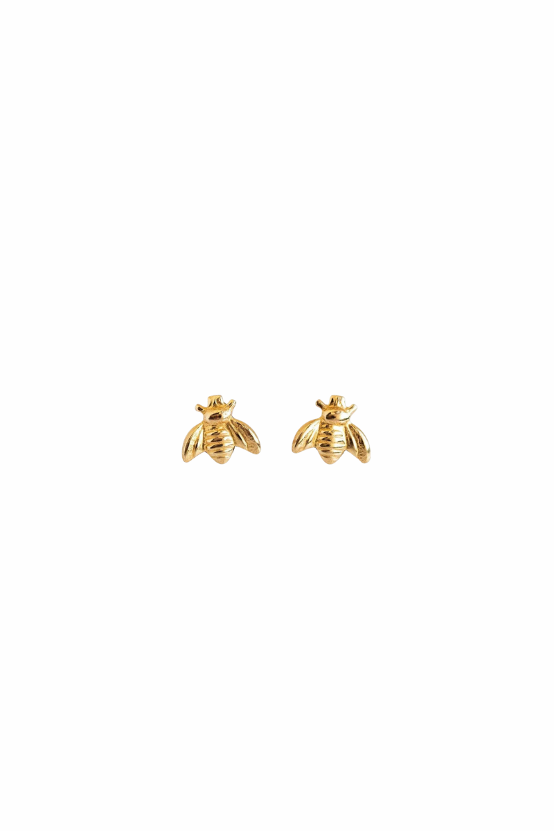 A pair of small gold bee stud earrings on a plain white background.