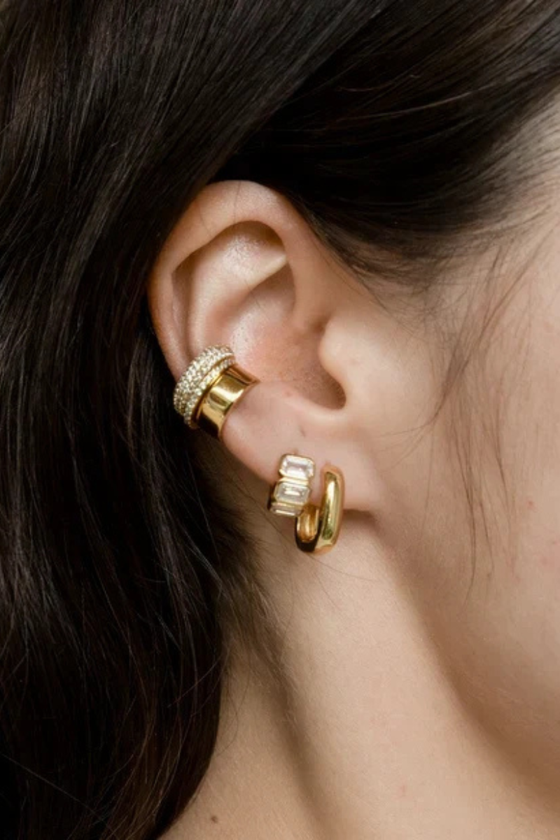 Sunset Huggie Hoop Earrings with other earrings on model