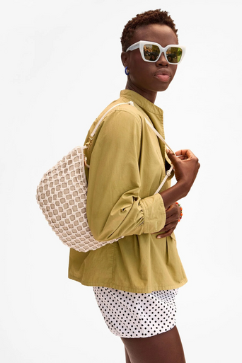 Clare V Lune Knot Woven Leather Bag on shoulder