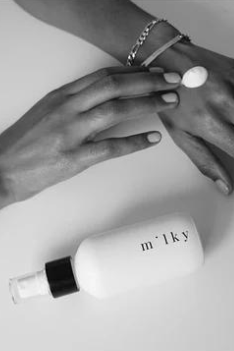 Riddle 4 oz Milky Spray Lotion Poppy, lotion on hand