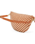A woven leather half-moon fanny pack with a brown and cream zigzag pattern, featuring a tan leather strap and gold-tone hardware, shown on a white background.