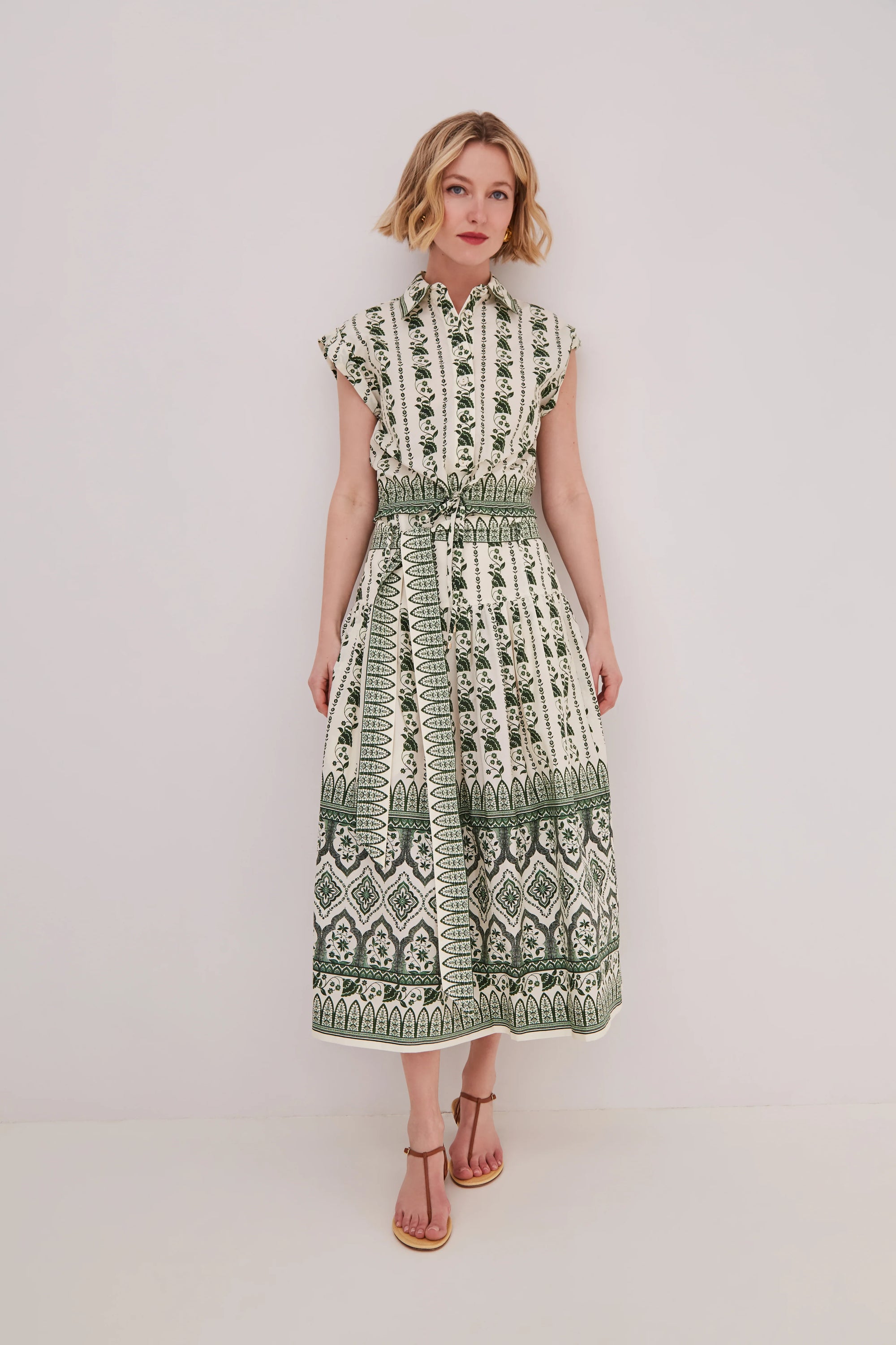 woman wearing a matching floral set on a white background