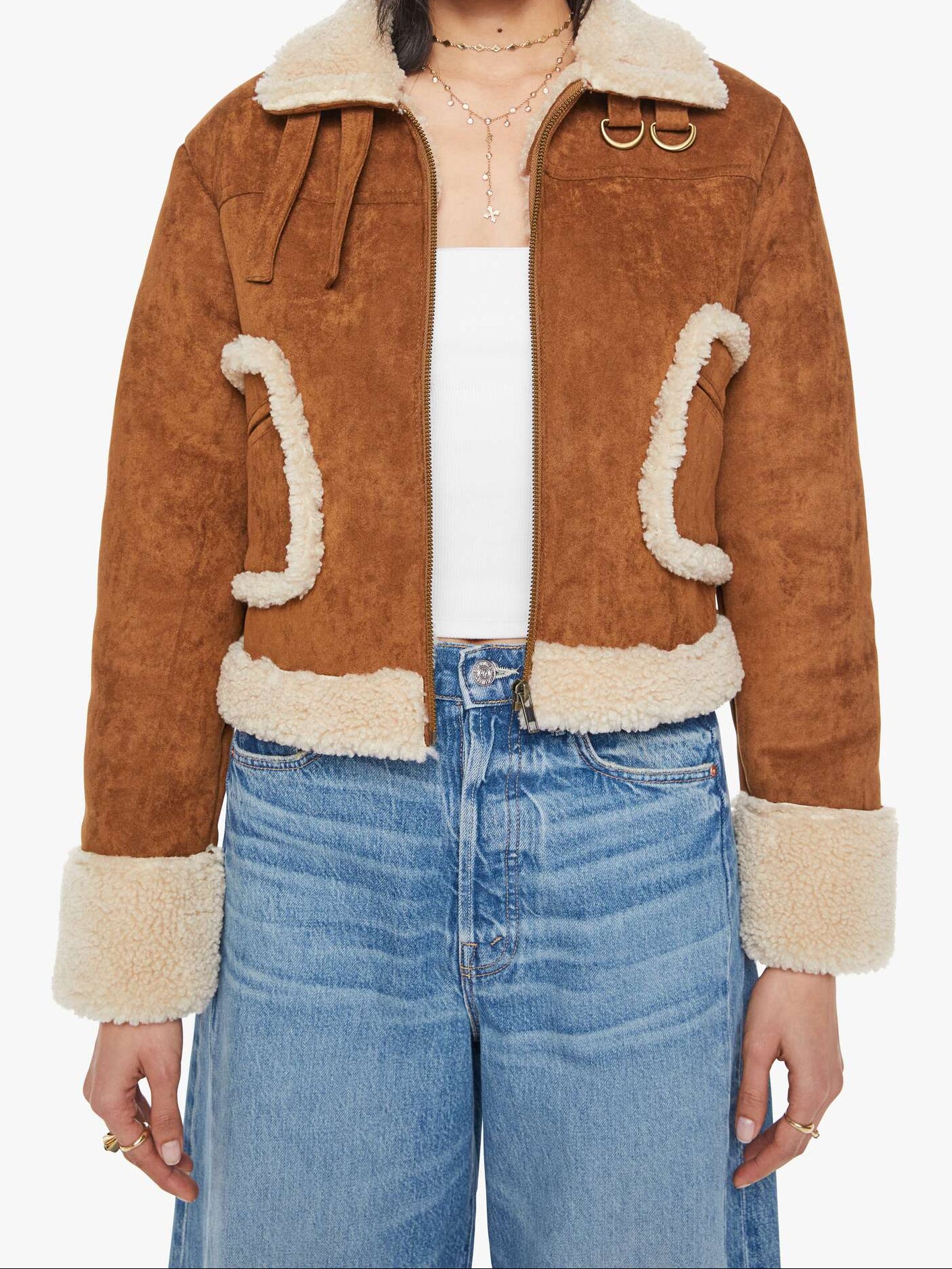 Brown suede jacket with white fur trim worn by a person on a white background
