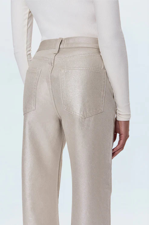 Beige pants worn by a person on a white background