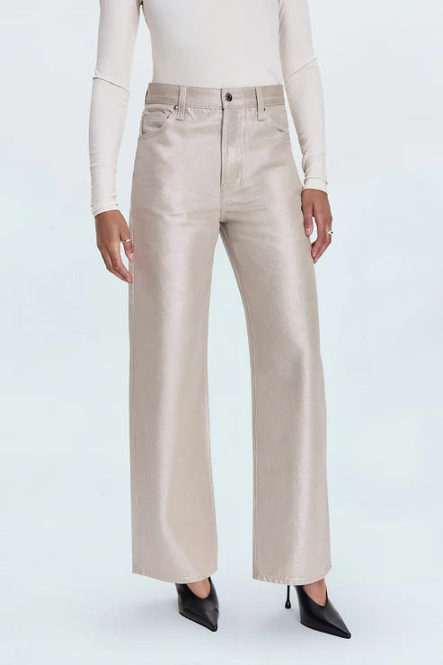 Beige wide-leg pants worn with a white top on a white background