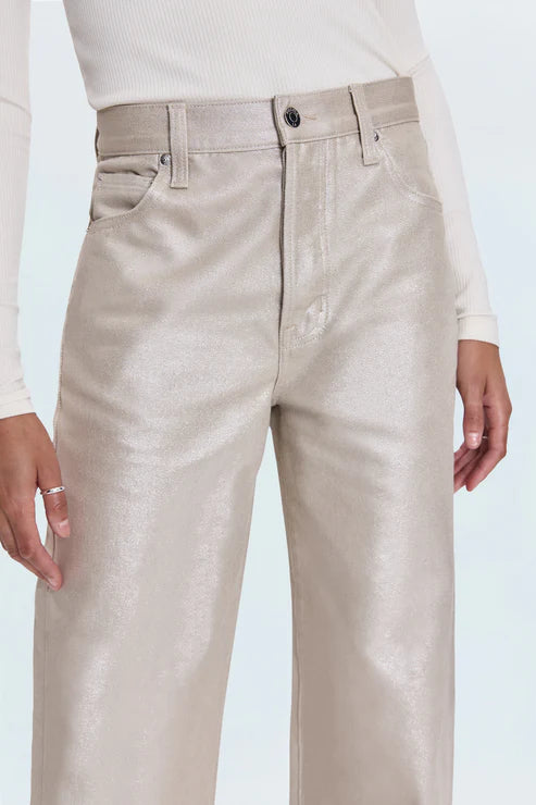 Beige pants worn by a person on a light blue background