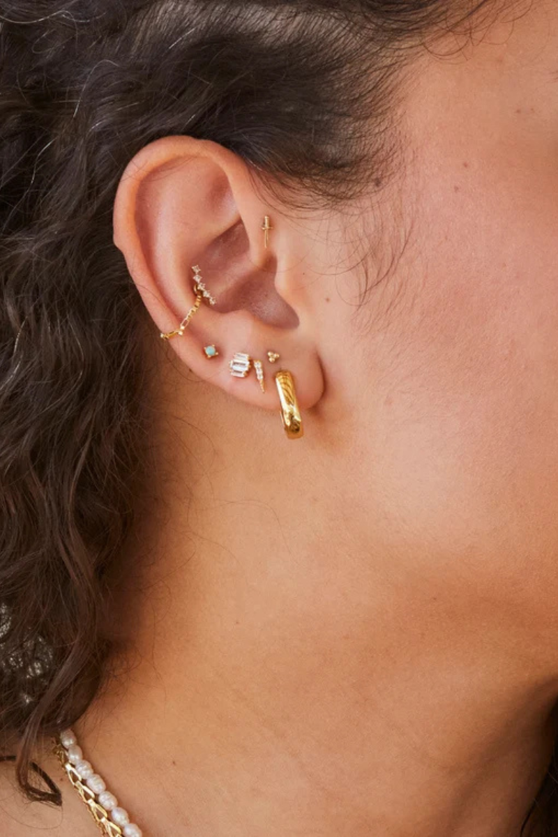 Deco Baguette Trio Studs with other earrings on model