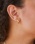 Deco Baguette Trio Studs with other earrings on model