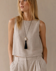 Bella Mare Shell Tassel Cord Necklace with beige linen tank