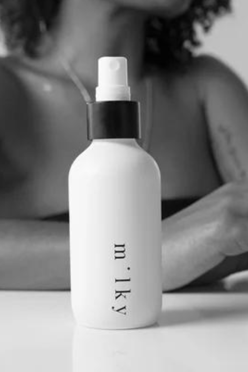 Riddle 4oz Milky Spray Lotion Original on table