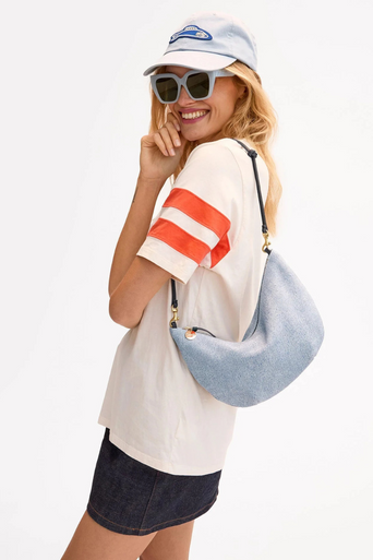 Clare V Lune Denim Suede Bag on shoulder, side view