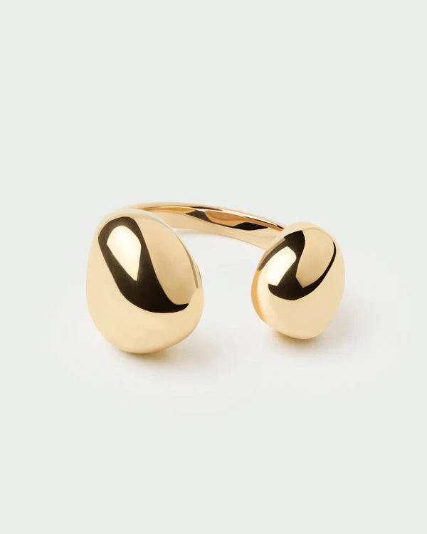 Gold ring with a minimalist design on a light gray background