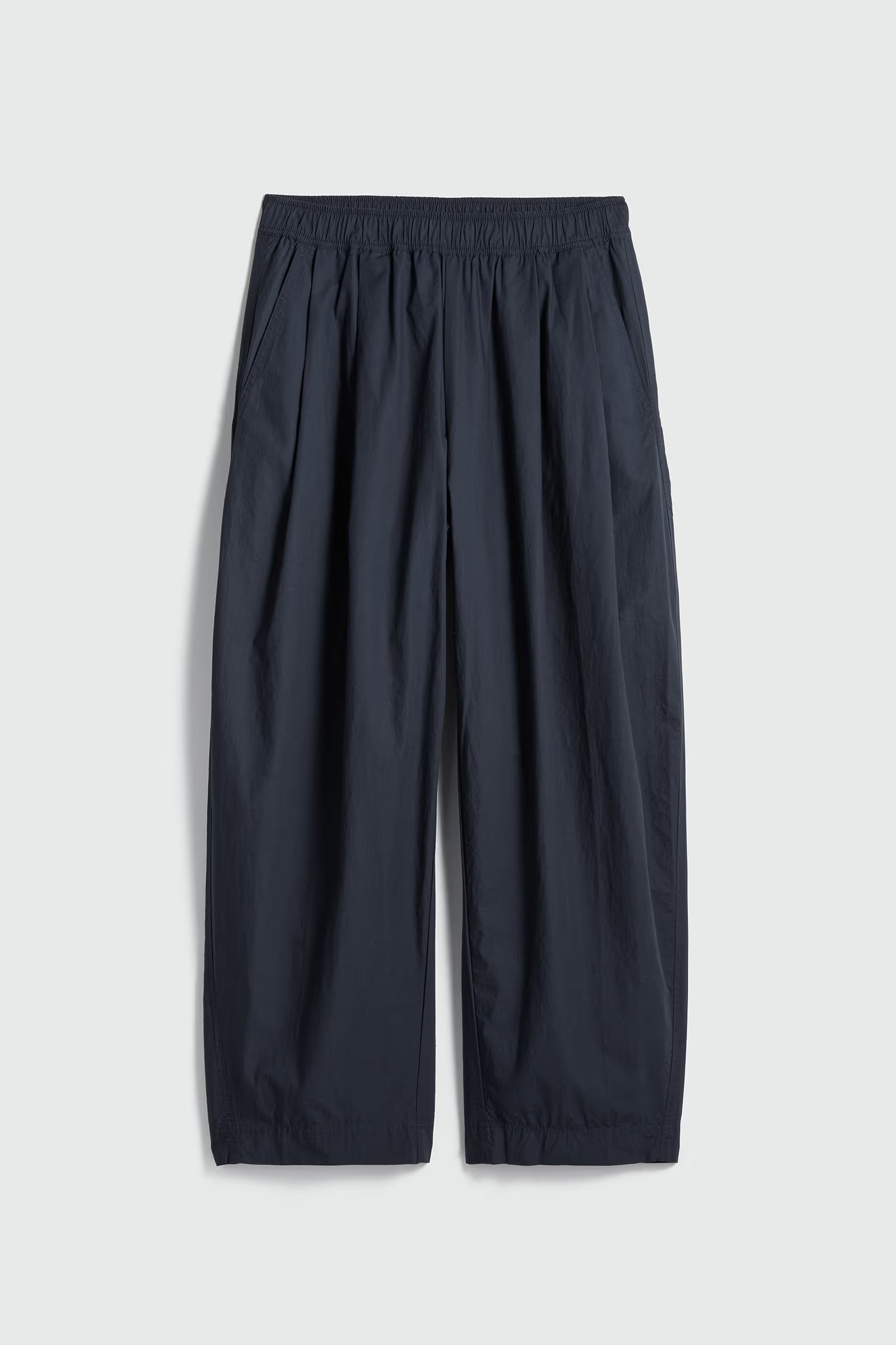 navy pants on a light gray background