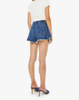 Woman wearing a white t-shirt and blue denim shorts on a white background