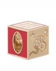 Gold and red cube charm with snake design and 'Year of the Snake' text on a white background