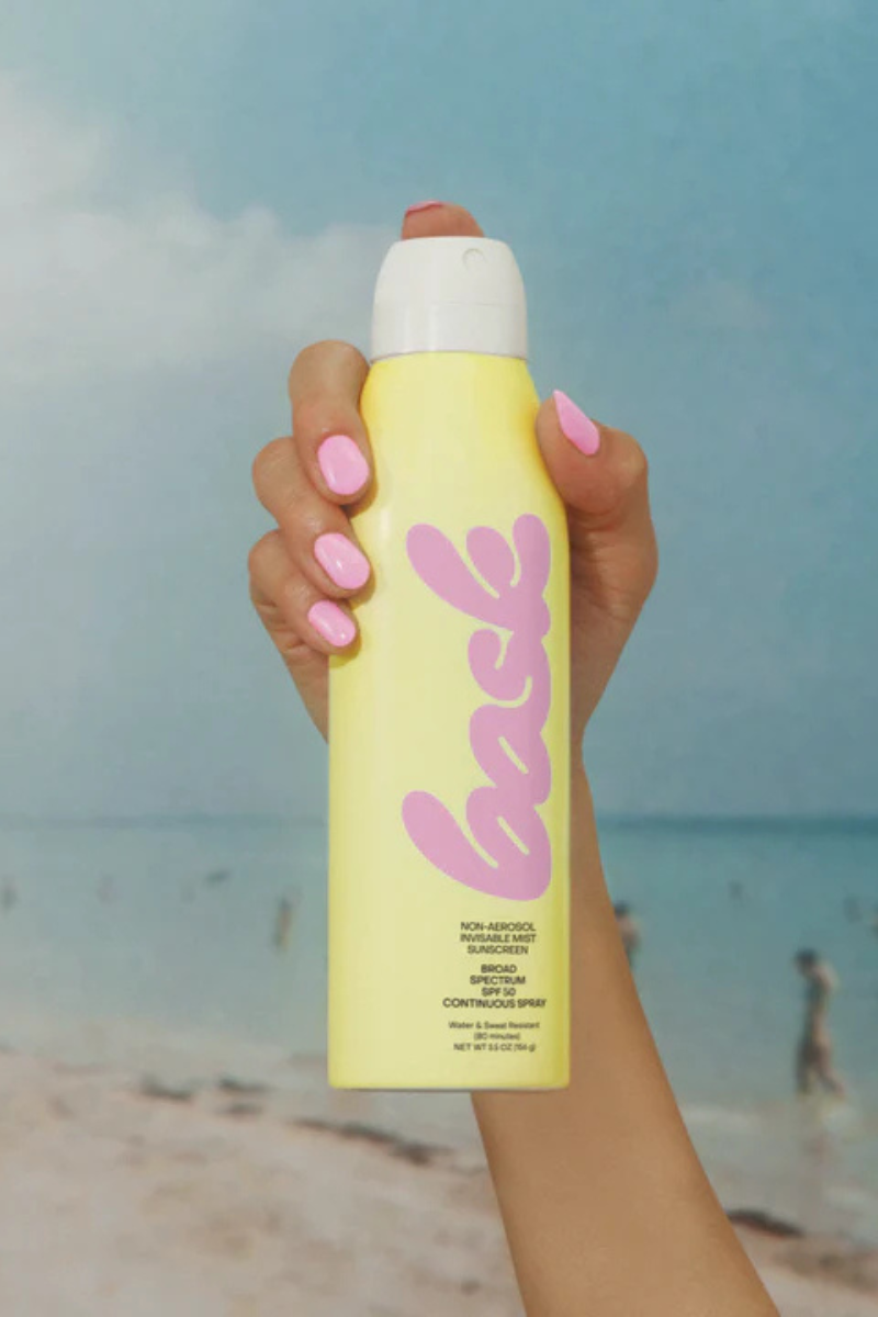 Bask SPF 50 Non-Aerosol Spray Sunscreen held