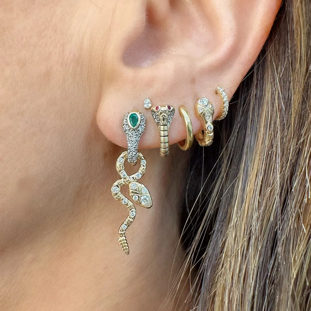 Single Diamondback Emerald Snake Hoop, first hole. Single King Cobra Hoop Earring with other earrings on ear, second hole