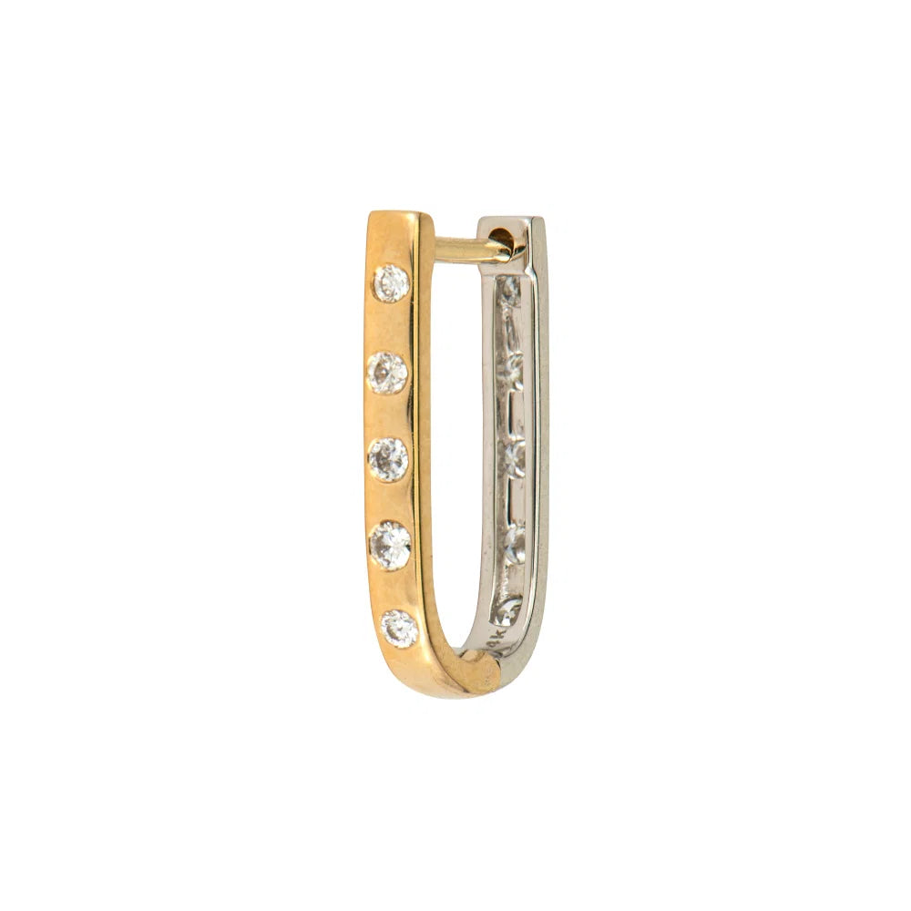 A small huggie hoop earring in two-tone yellow and silver white gold, featuring five clear round-cut stones set along the front.