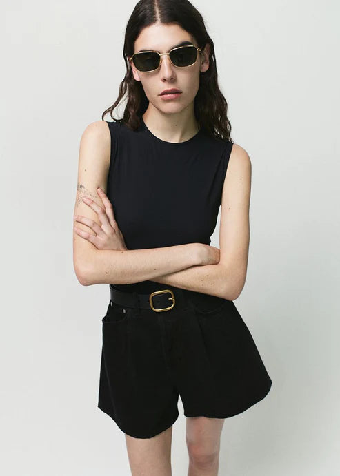 Rhoda Short with belt and black tank
