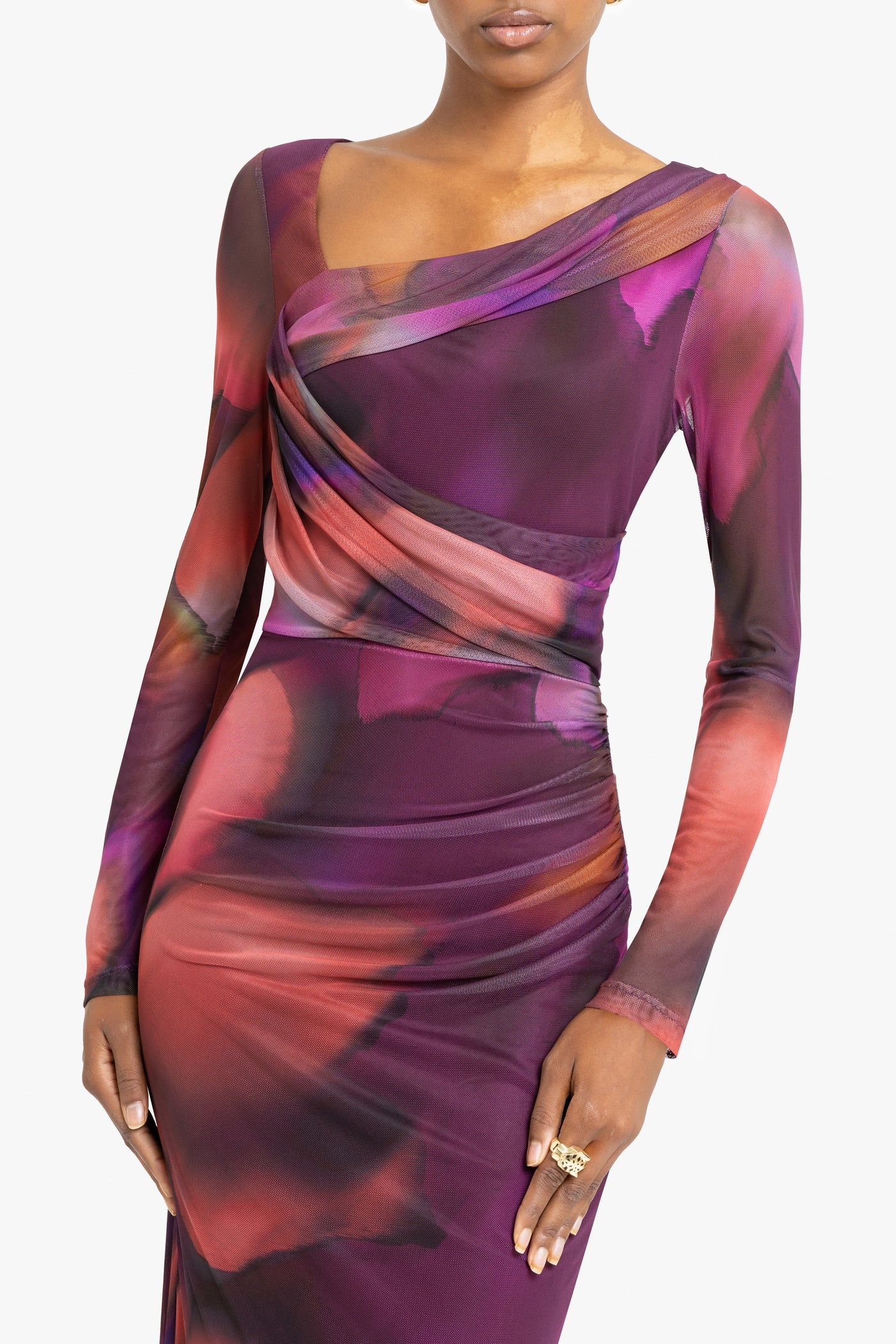 Long-sleeve dress with abstract multicolor pattern on a white background up close view
