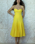Erica Midi Dress full body front view of model leaning against wall