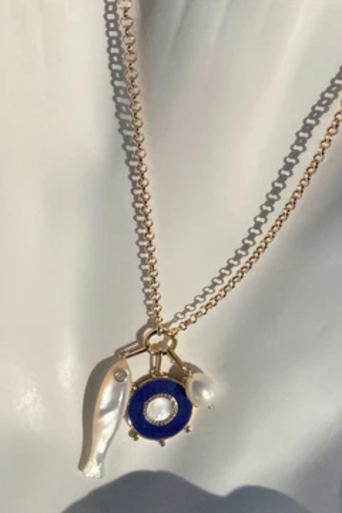 Thatch Soleil Lapis and Mother of Pearl Charm with other charms