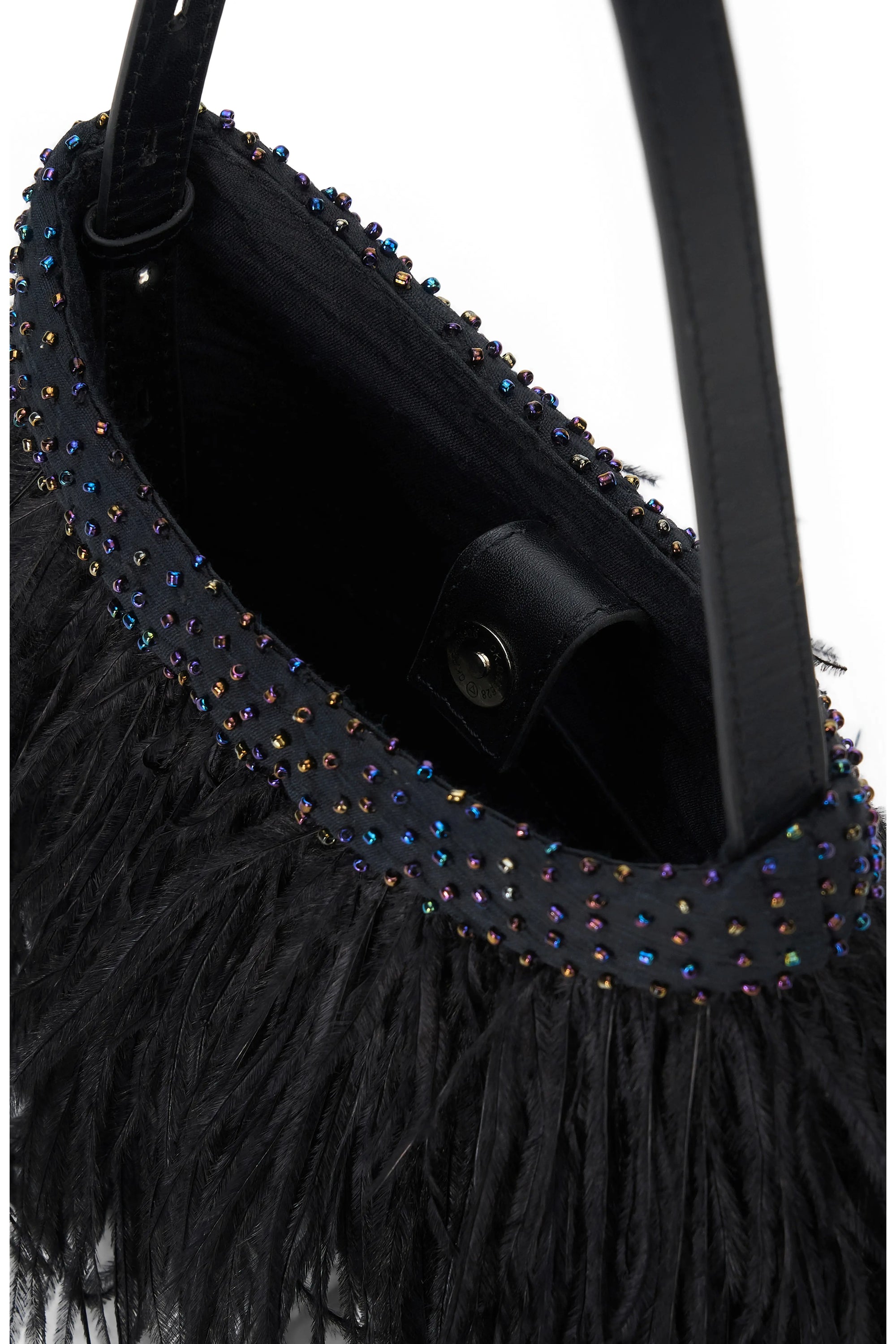 Close-up of a black feathered handbag with iridescent rhinestone trim and a black strap, shown against a plain white background.