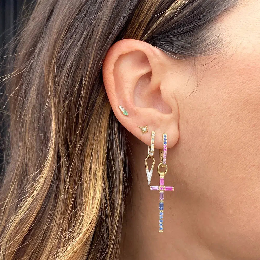 Single Classic Open Dagger Charm on model's ear paired with a few other earrings