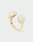 Gold ring with two quartz stones on a light gray background