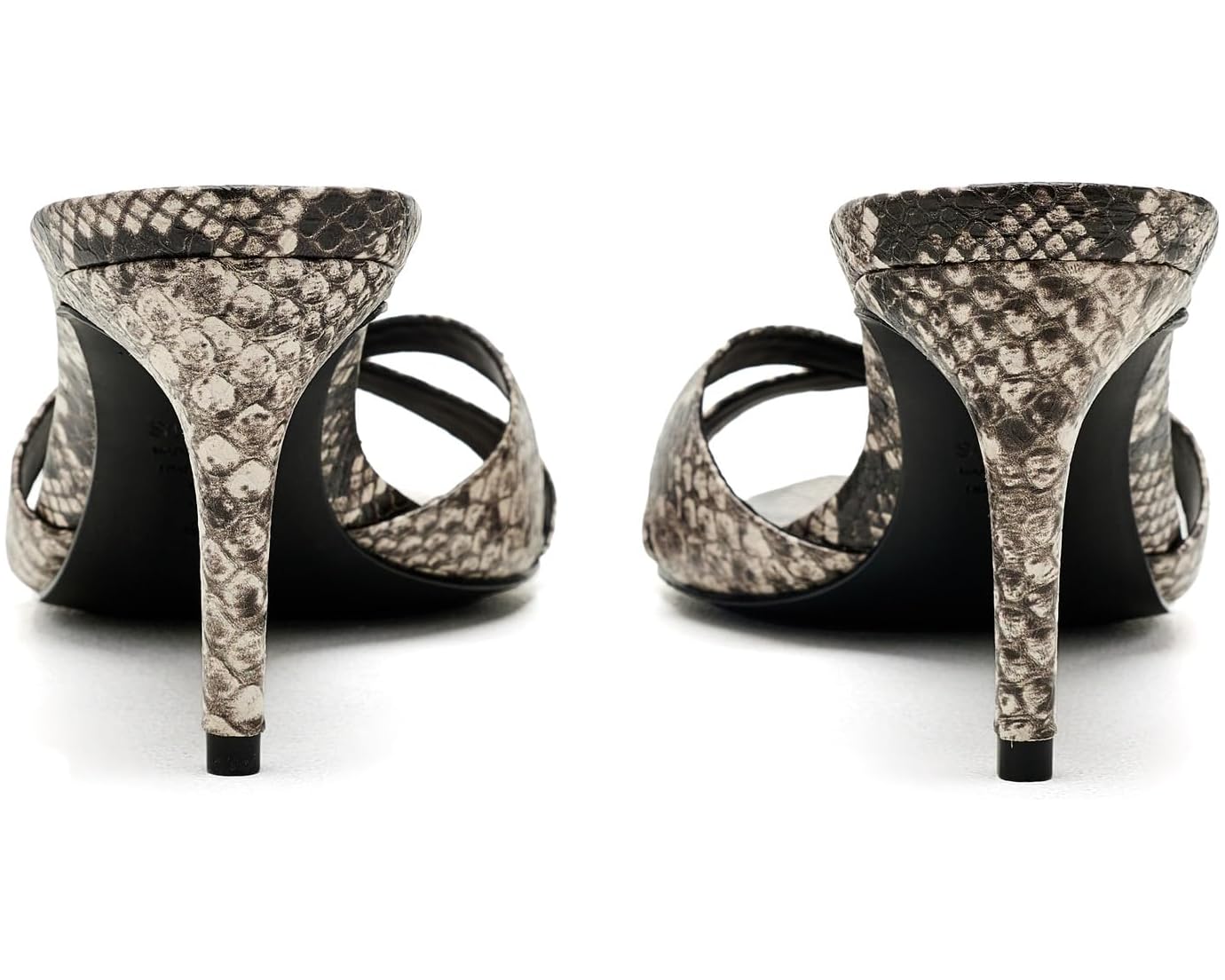 A pair of women's high-heeled sandals with a snakeskin pattern in gray, black, and beige, shown from the back on a white background.
