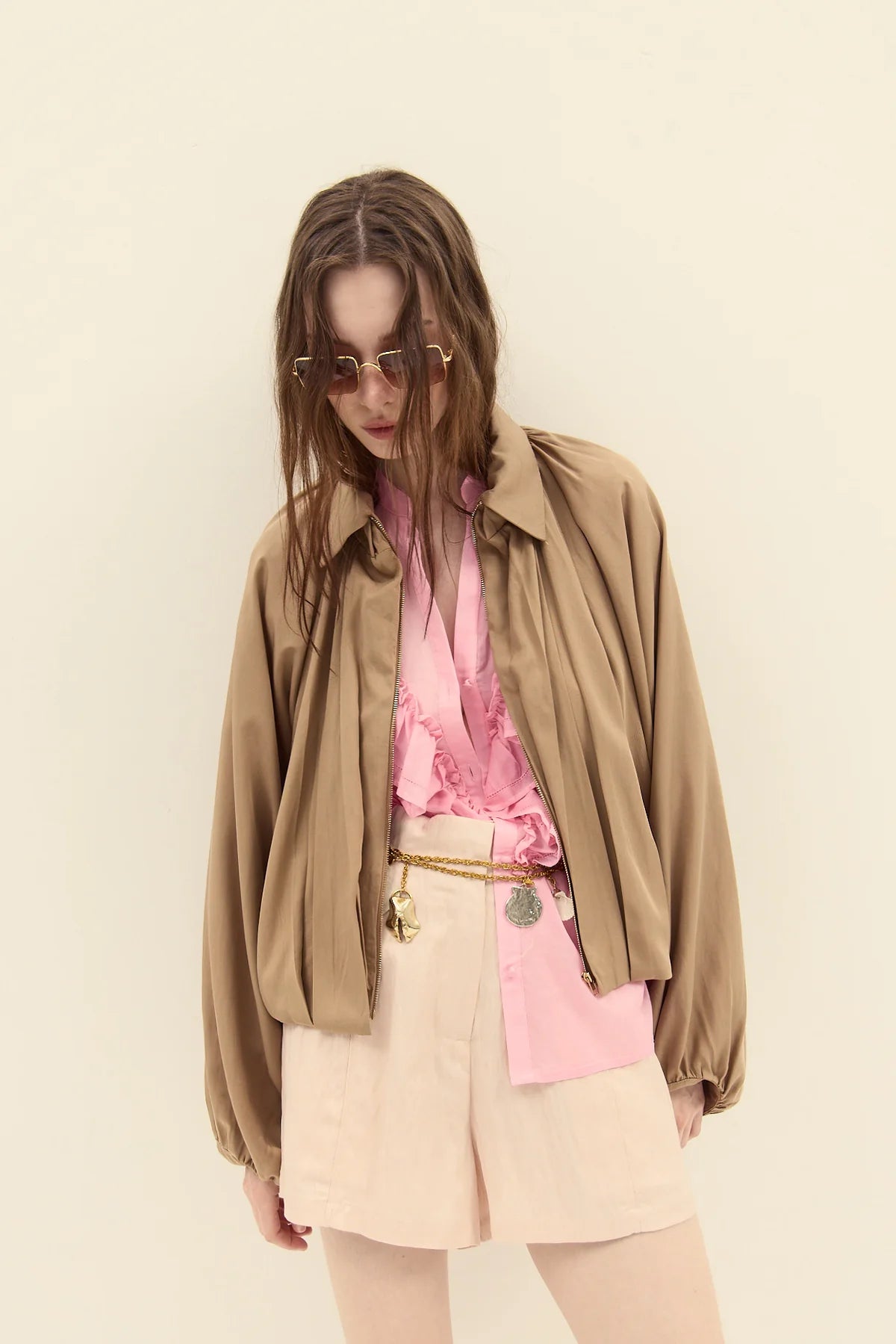 Paxos Short with pink top and brown jacket