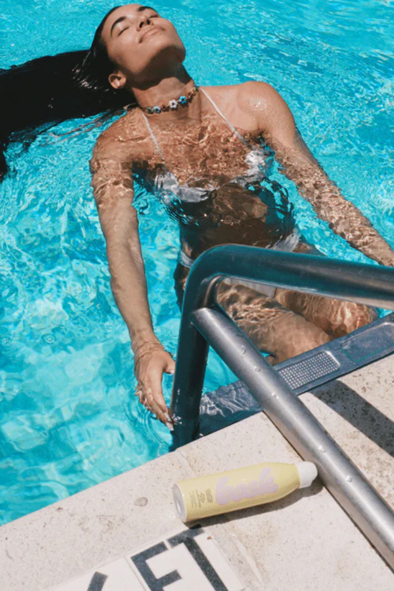Bask SPF 50 Non-Aerosol Spray Sunscreen by the pool