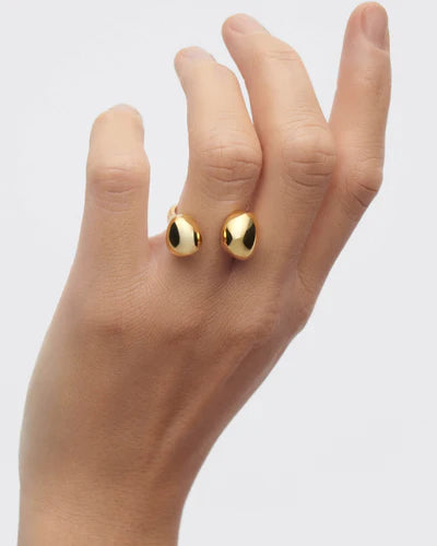 Gravity Ring on a hand against a light gray background