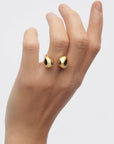 Gravity Ring on a hand against a light gray background