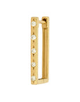 Gold earring with embedded diamonds on a white background